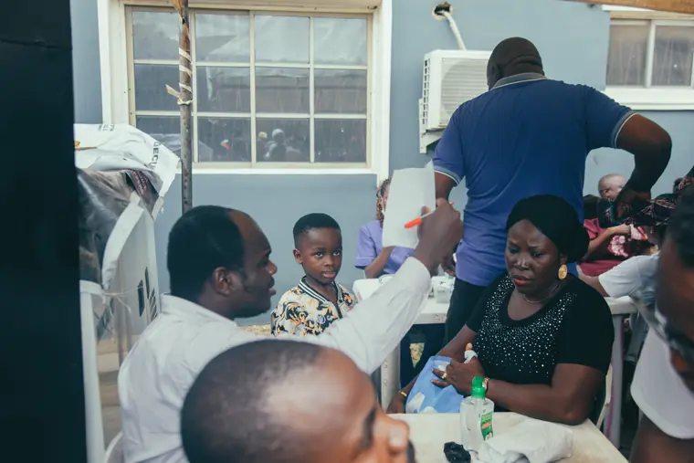 A child is seen by medical staff at the outreach.